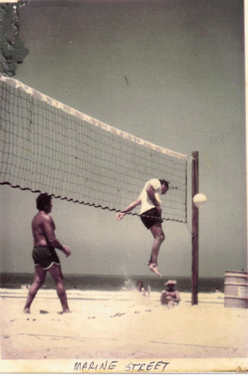 Jack shows it how it  get done playing Volleyball at Marine St.