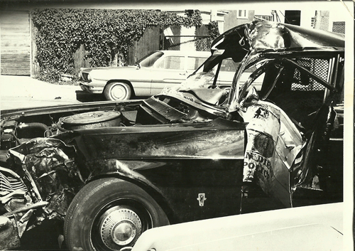 Over excited cop rolls his car trying to bust a Mac Meda Convention - Photo taken by I believe Jon Sarrett